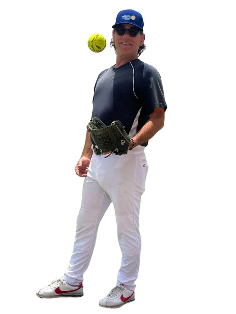 Instructor-Darren-Elliott-catching-a-softball Darren-Elliott-catching-a-ball-during-his-softball-team-clinic
